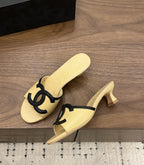 Chanel Interlocking CC Heeled Mules Yellow & Black. Salto 5 cm.