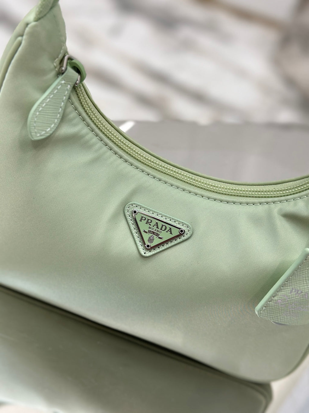 Bolsa Prada mini Re-Edition 2000
