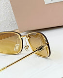 Óculos Miu Miu Gold