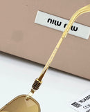 Óculos Miu Miu Gold