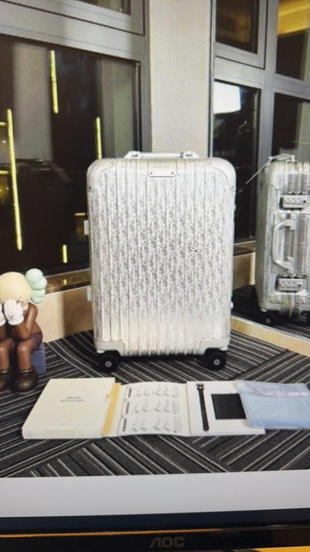 Mala Dior And Rimowa Carry-On Suitcase