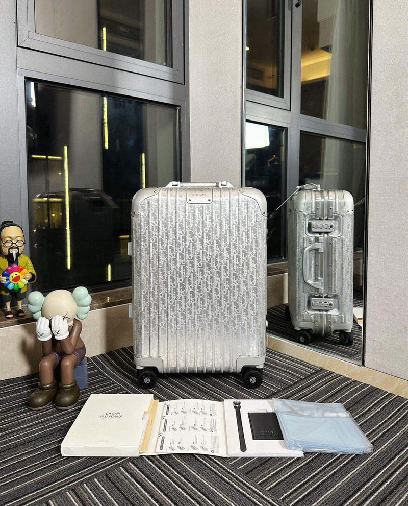 Mala Dior And Rimowa Carry-On Suitcase