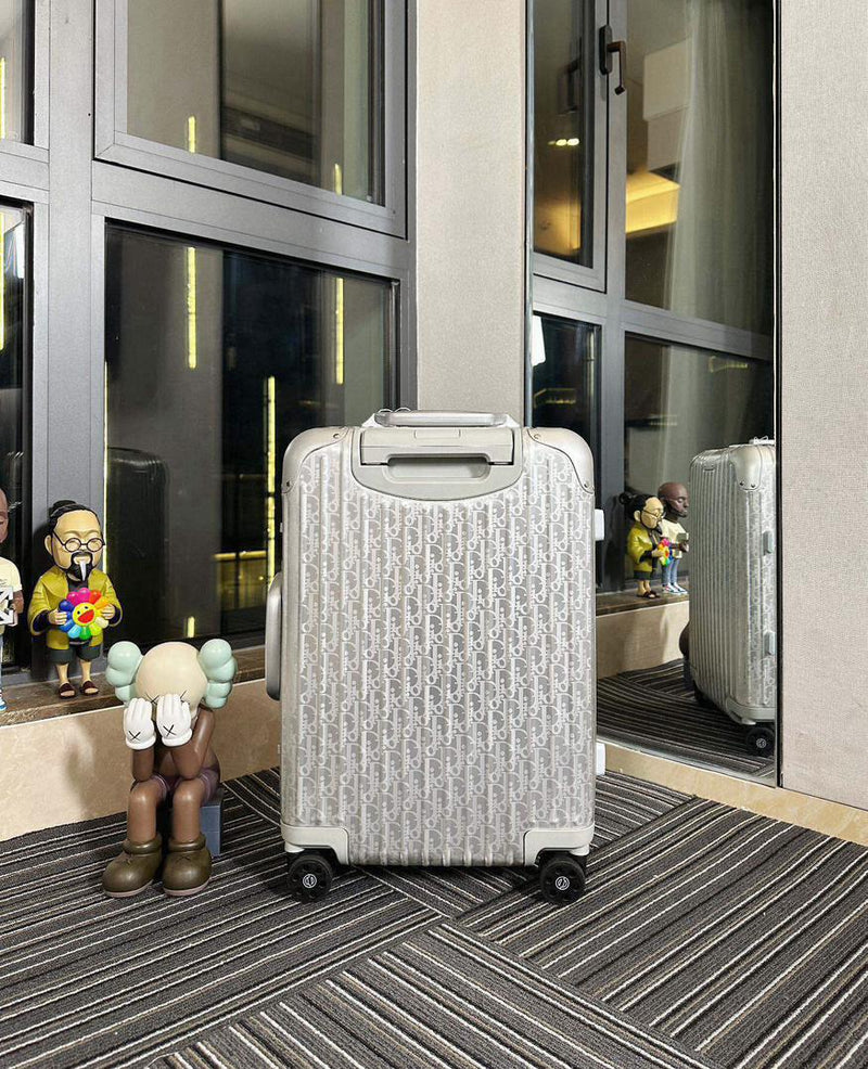 Mala Dior And Rimowa Carry-On Suitcase