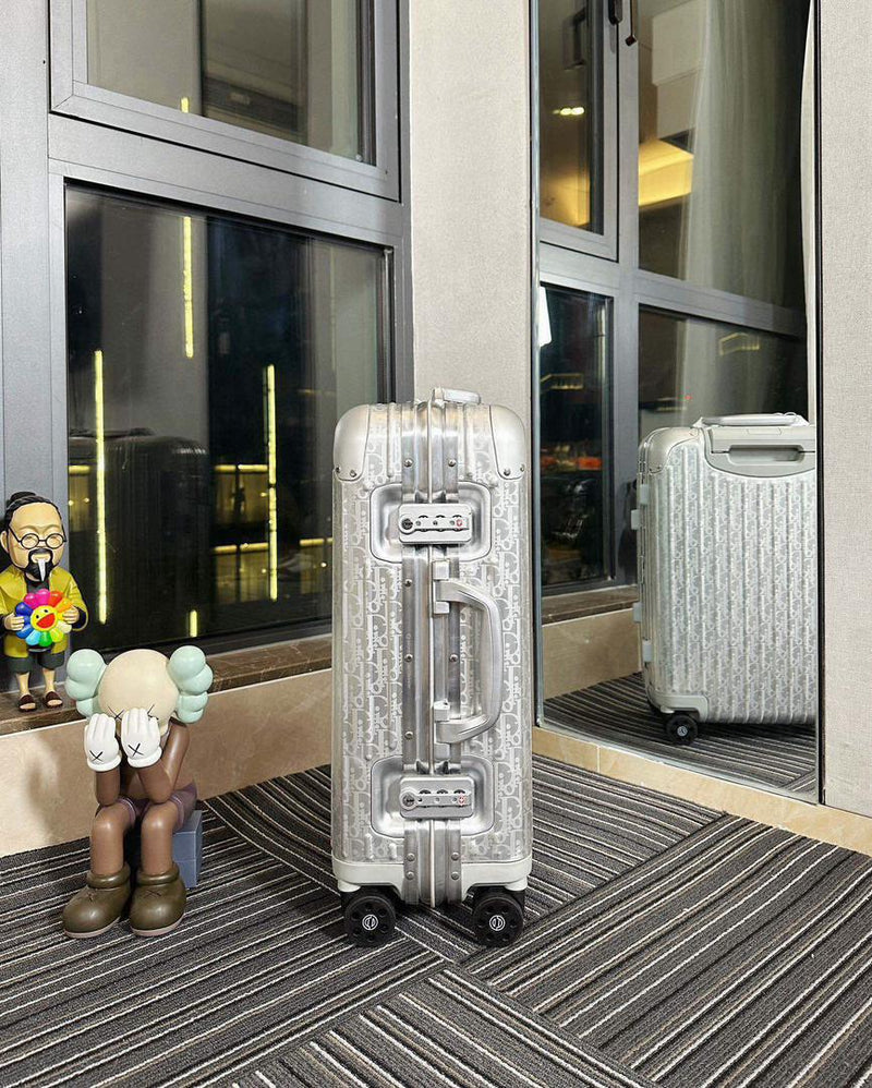 Mala Dior And Rimowa Carry-On Suitcase