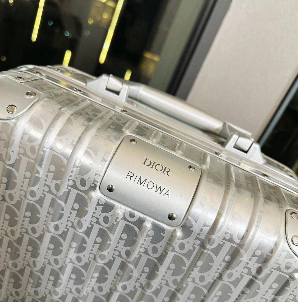 Mala Dior And Rimowa Carry-On Suitcase