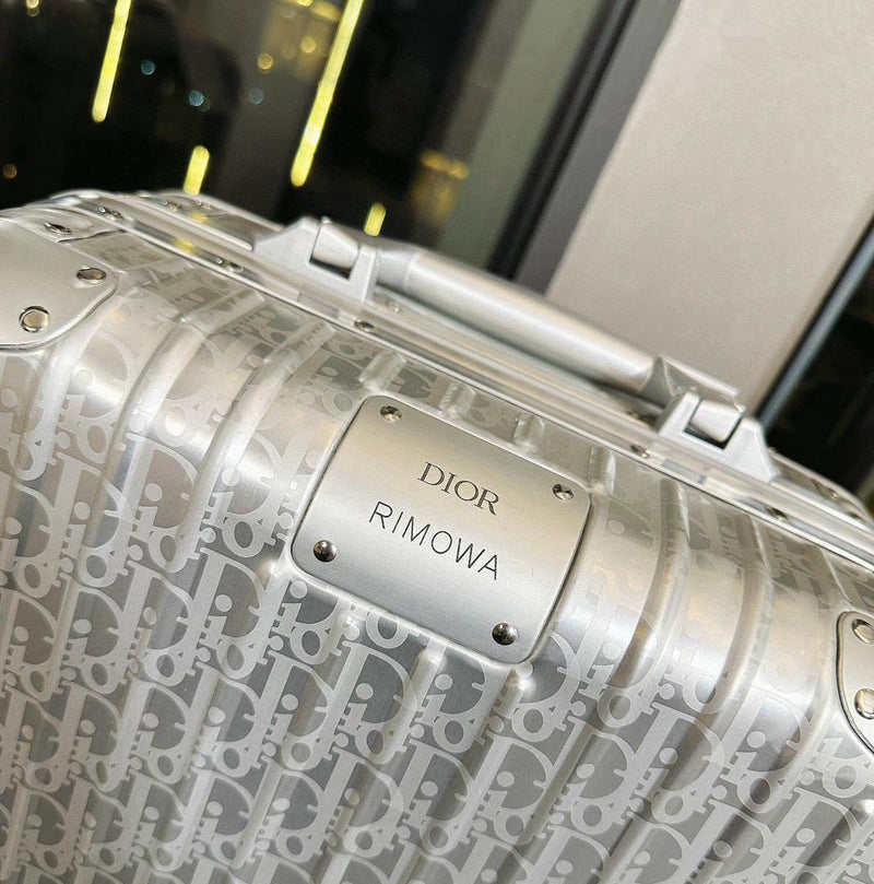 Mala Dior And Rimowa Carry-On Suitcase