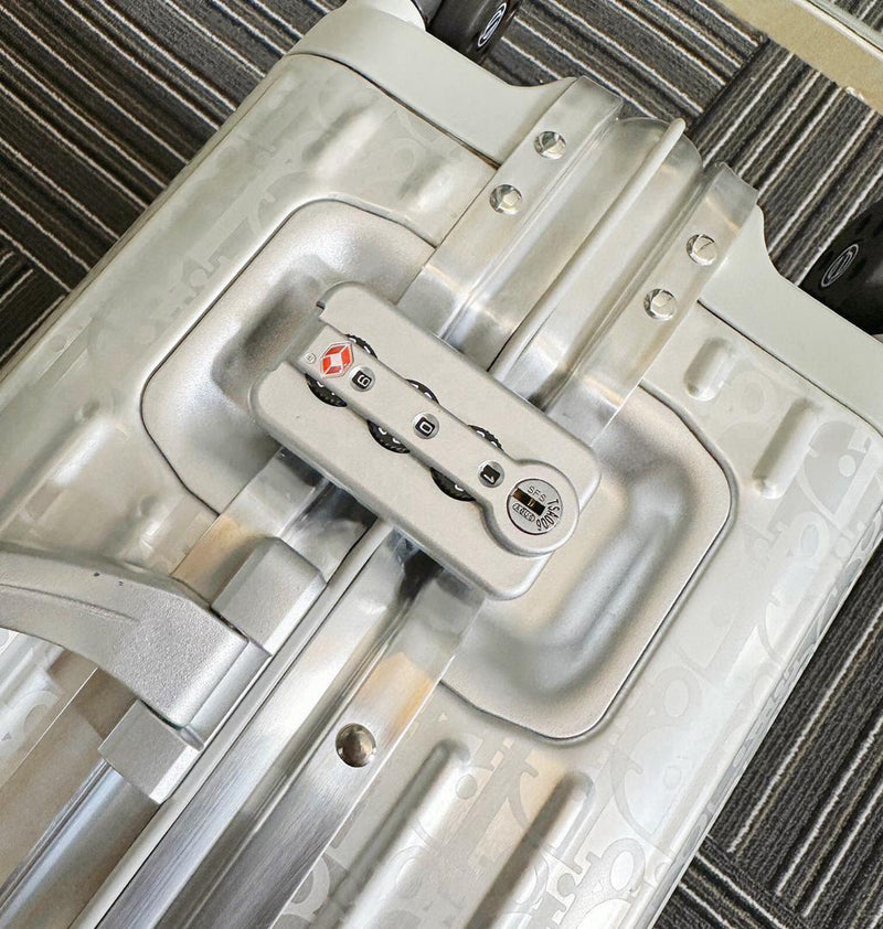 Mala Dior And Rimowa Carry-On Suitcase