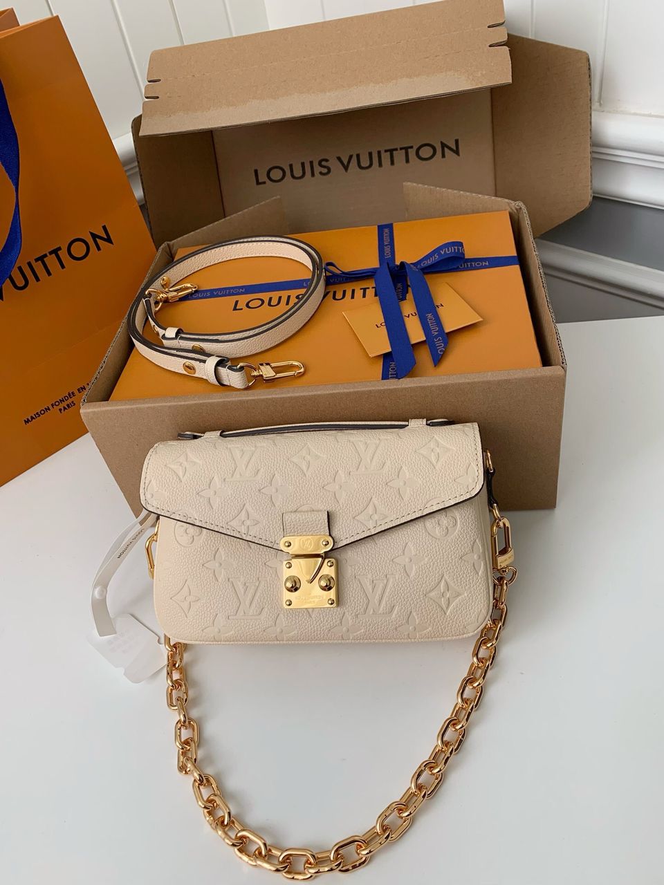 Pochette Métis East West Monogram Empreinte Cream
