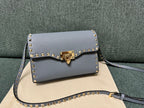 Valentino Garavani Rockstud Small Crossbody Bag Light Blue .
